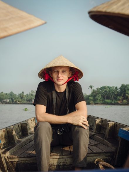 Can Tho, Vietnam - April 02, 2016: Tourist in Vietnamese hat going on a trip on Mekong delta by boat. Group of tourists going to the floating market Cai Rang, popular tourist destination near Can Tho